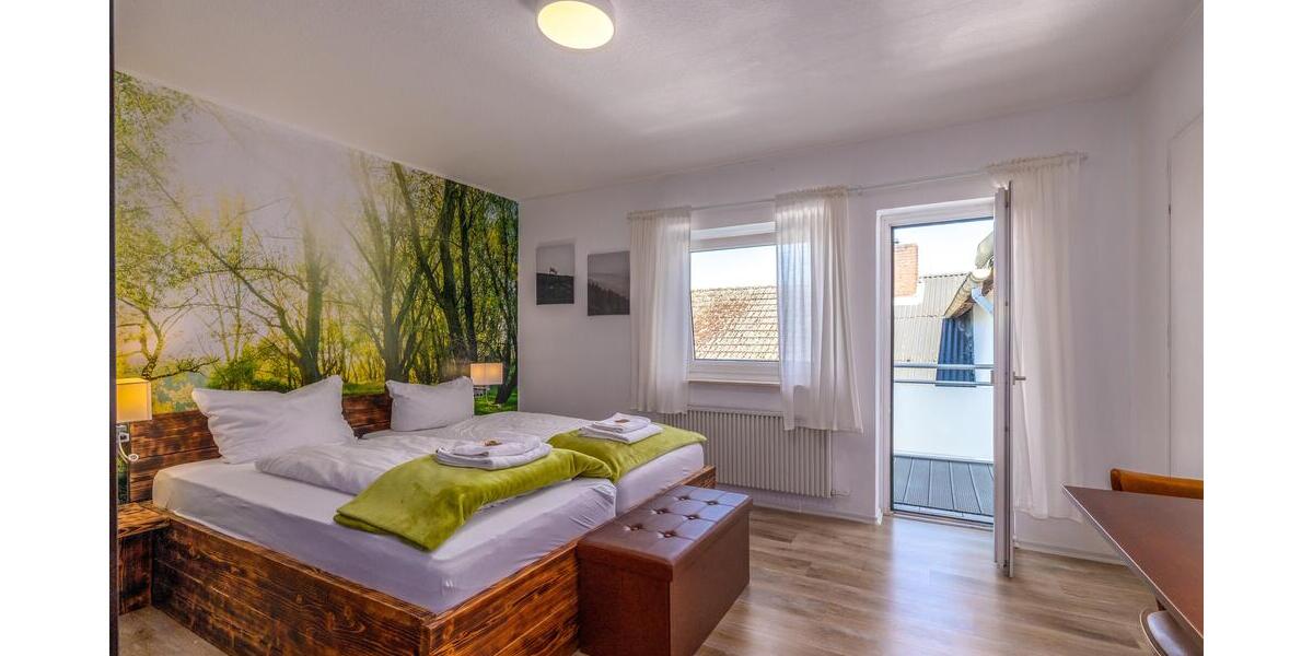 Doppelbettzimmer mit Balkon